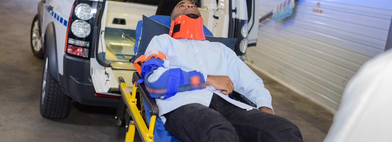 adult man lying on the stretcher